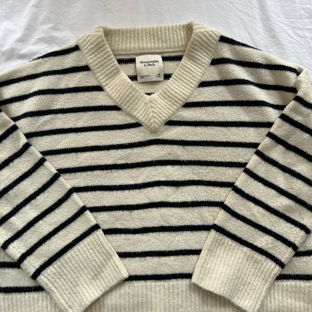 Black and white striped v neck sweater